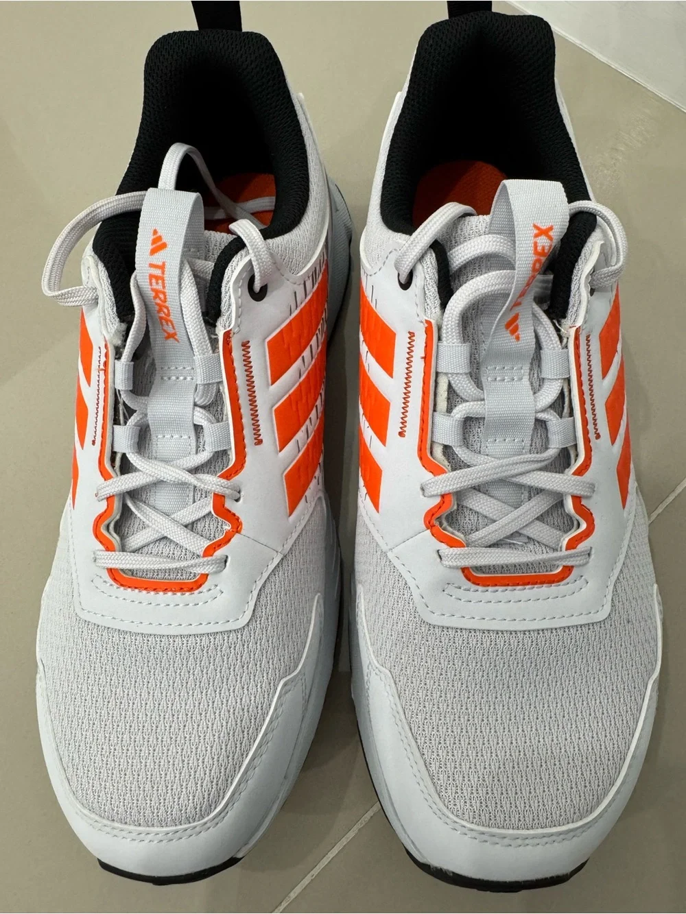 Adidas Men's White Athletic Shoes with Orange Accents